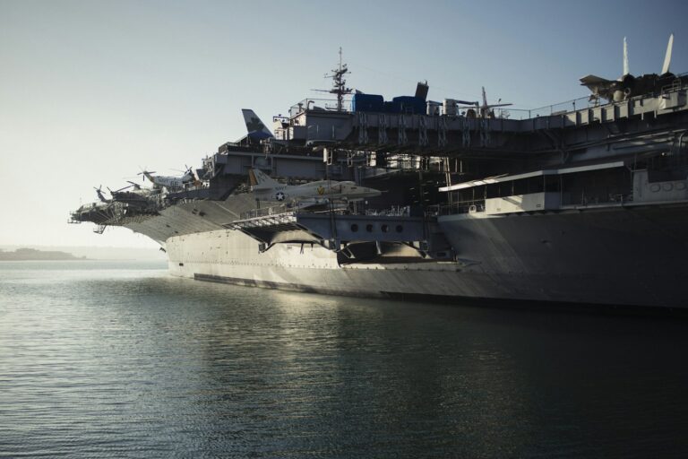 U.S. Navy aircraft carrier moored on calm water